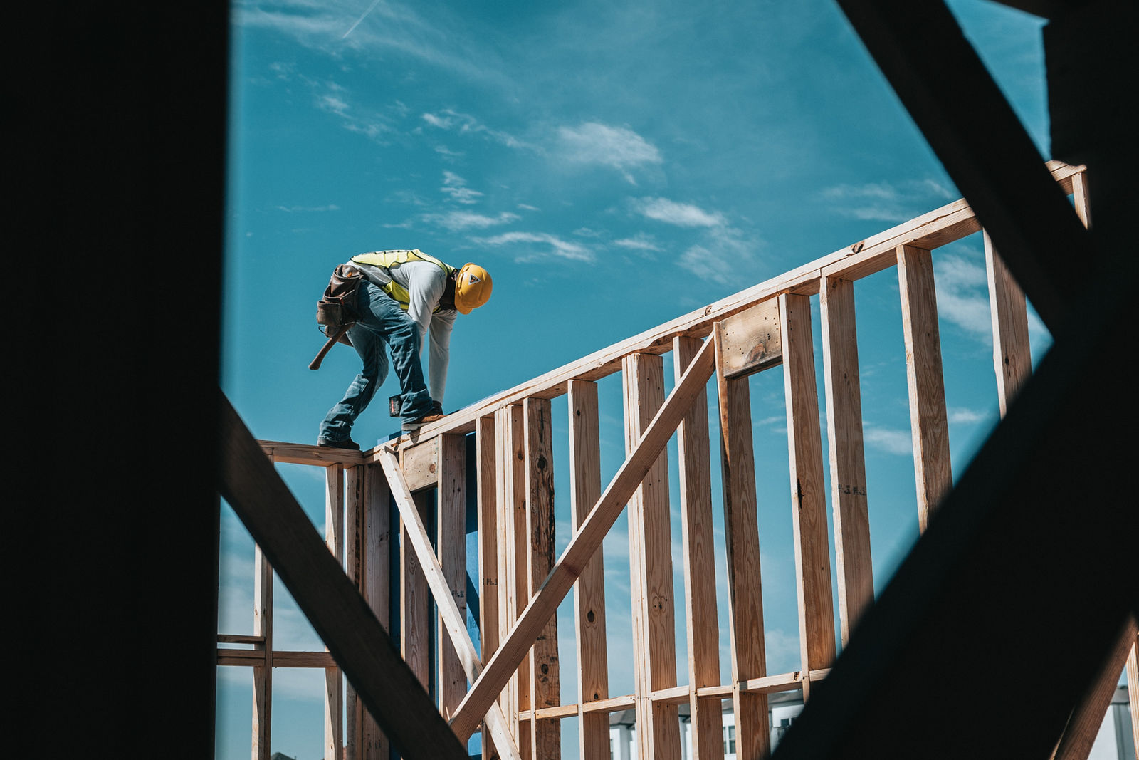Carpenter framing a structure on a residential jobsite
